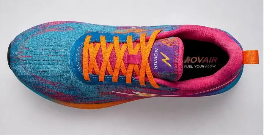 Top-down view of the NOVAIR running shoe — teal and magenta knit upper, orange laces, printed tongue label